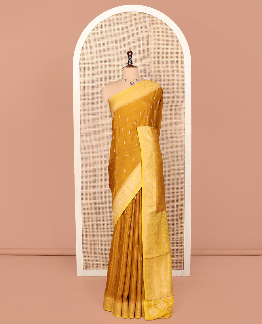 Mustard Fancy Crepe Saree, Adorned with Buttas, Complemented by a Contrast Floral Creeper Border, Intricately Designed Pallu, and a Contrast Blouse