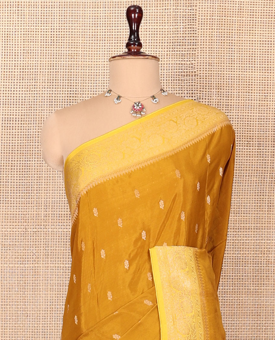 Mustard Fancy Crepe Saree, Adorned with Buttas, Complemented by a Contrast Floral Creeper Border, Intricately Designed Pallu, and a Contrast Blouse