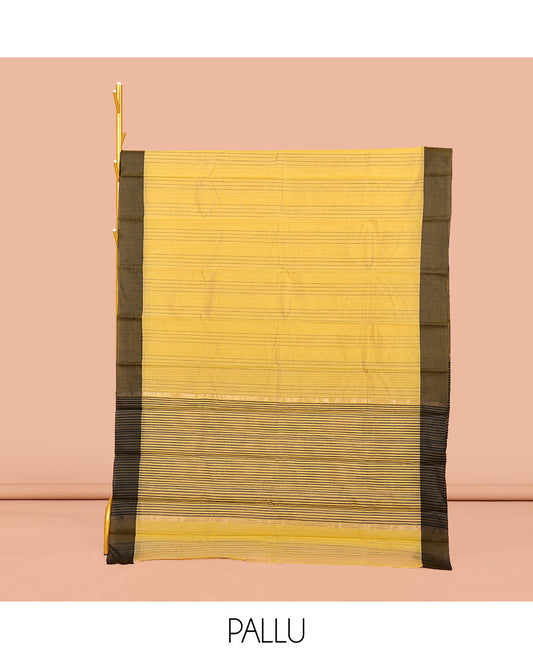 Yellow Semi-Silk Cotton Saree, Sparsely Sparkled with stripes All Over Its Body, complemented by a Contrast Border, Striped Pallu, and Paired with a Matching Blouse