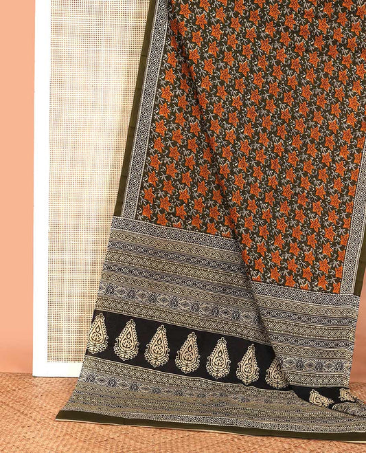 green floral printed mul mul cotton saree, diamond patterns printed border, and pallu of geometric print