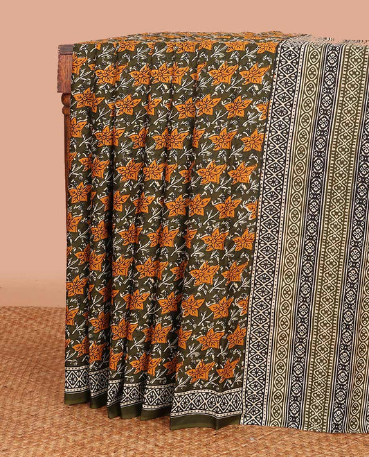 green floral printed mul mul cotton saree, diamond patterns printed border, and pallu of geometric print