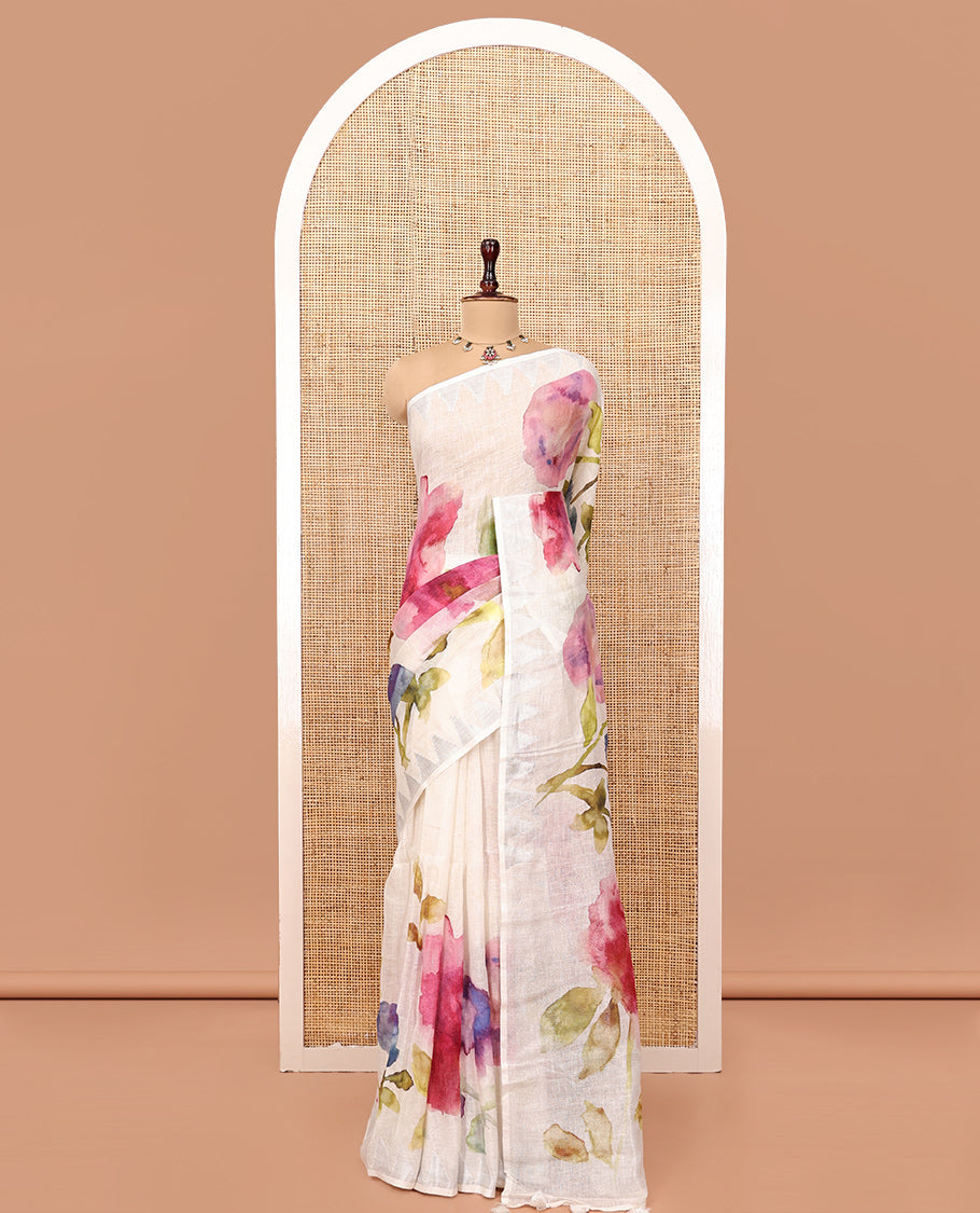 Cream-Base Linen Saree, Highlighted by Floral-Themed Paint Splashes, Hand-Brush Painted All Over Its Body, Sparsely Woven Temple Border, and Paired with a Matching Blouse