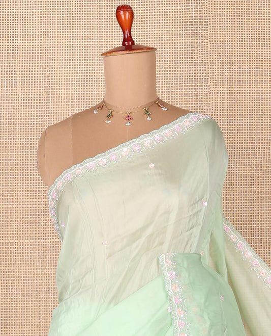 Light pistachio green embroidered designer saree with scallop embroidered border