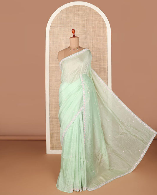 Light pistachio green embroidered designer saree with scallop embroidered border