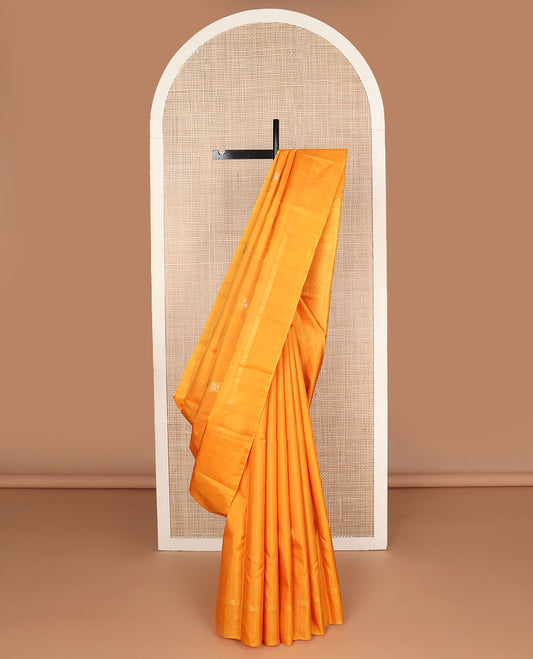 Borderless yellow zari mayil buttas Kanchipuram silk saree, self-pallu steeped with mayil & chakram motifs