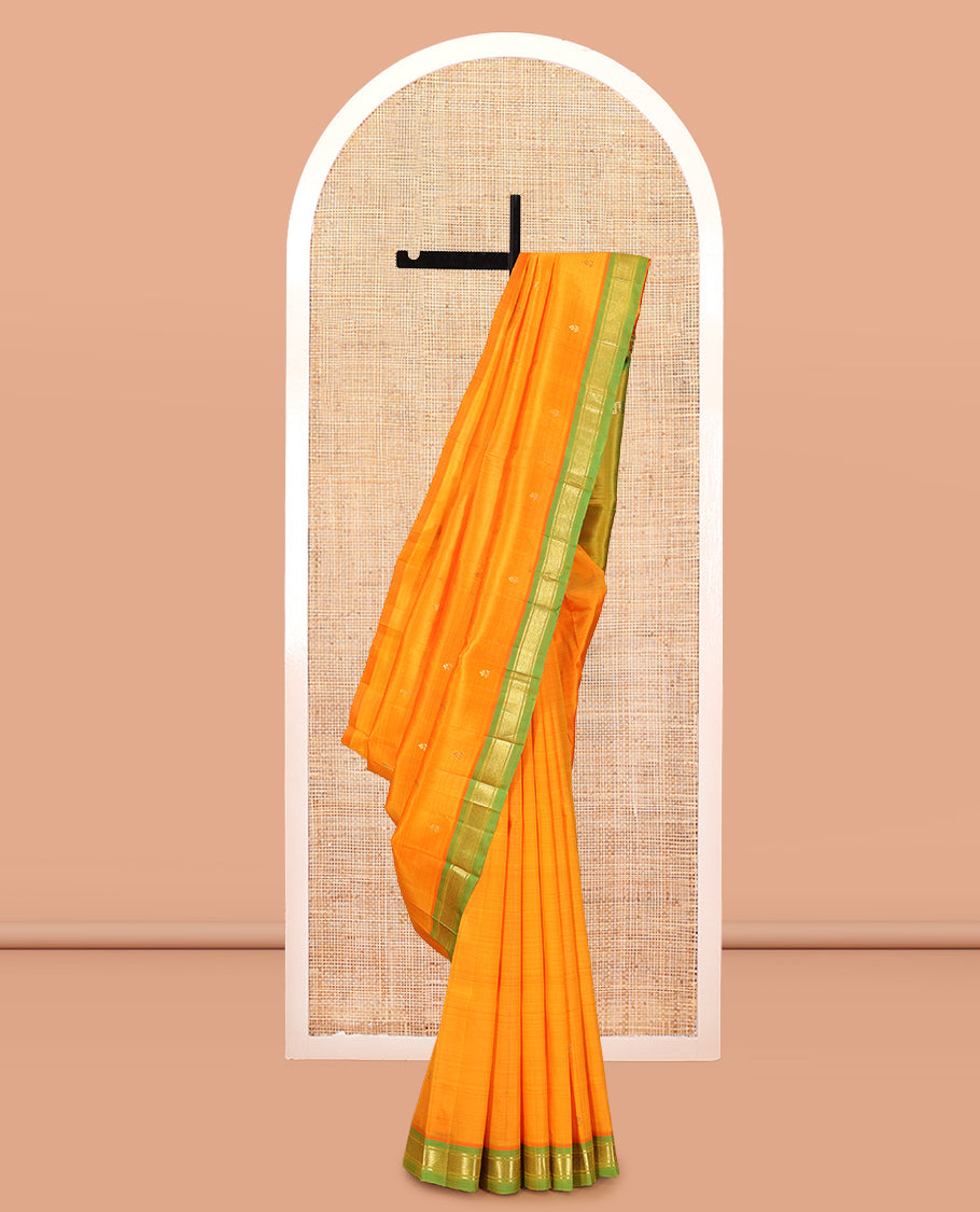 Orange Kanchipuram Silk Saree Featuring Zari Buttas, Complemented by a Contrast Border of Banaras and Mayil Kann Design, Pallu of Zari Design, and No Blouse