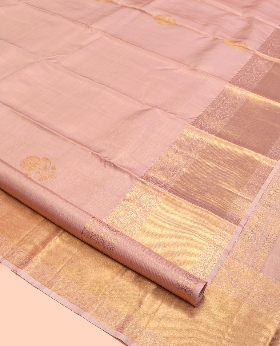 Rose Gold Kanchipuram Silk Saree, Delicately Woven with Floral Buttas All Over Its Body, Highlighted by Zari Border of Thilakam Mokku, Neli, Poun, and Kodi Visiry Designs, Gleaming Pallu, and Paired with a Matching Blouse
