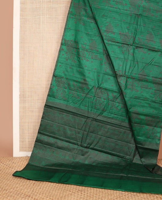 Borderless green tussar saree with floral zari buttas, zari pallu of intricate designs