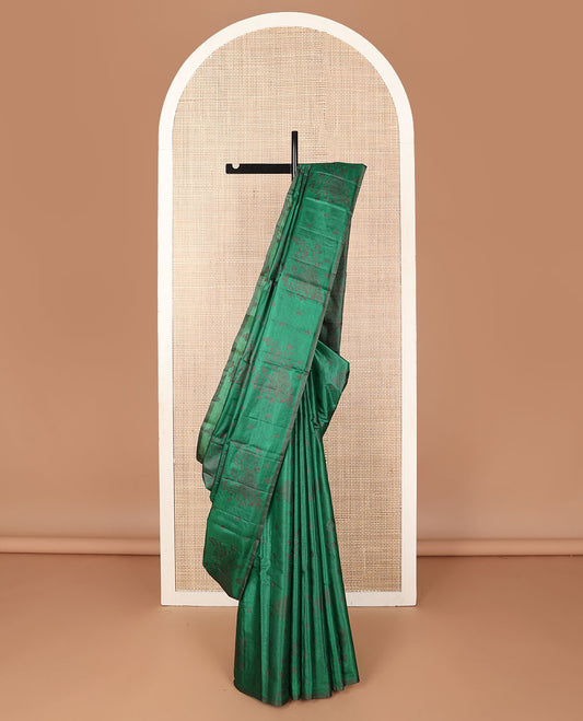 Borderless green tussar saree with floral zari buttas, zari pallu of intricate designs