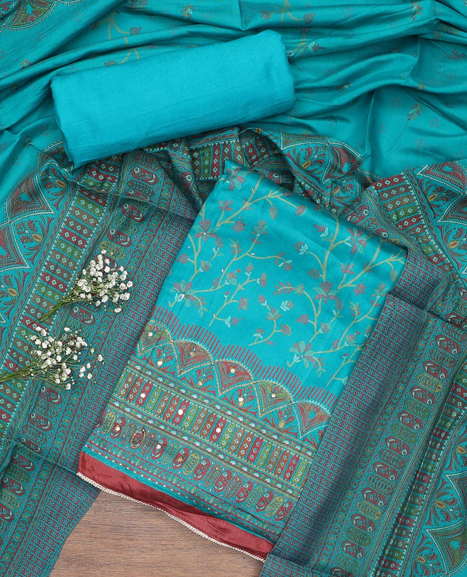 Blue material churidar set, floral and kaleidoscopic geometric patterned rayon top, plain bottom, and dupatta of floral and geometric patterns