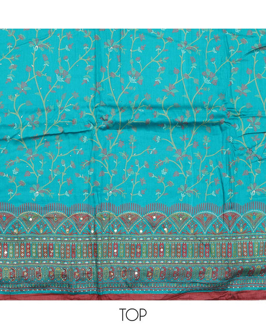 Blue material churidar set, floral and kaleidoscopic geometric patterned rayon top, plain bottom, and dupatta of floral and geometric patterns