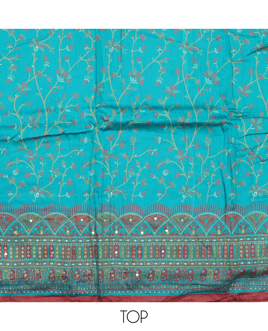 Blue material churidar set, floral and kaleidoscopic geometric patterned rayon top, plain bottom, and dupatta of floral and geometric patterns