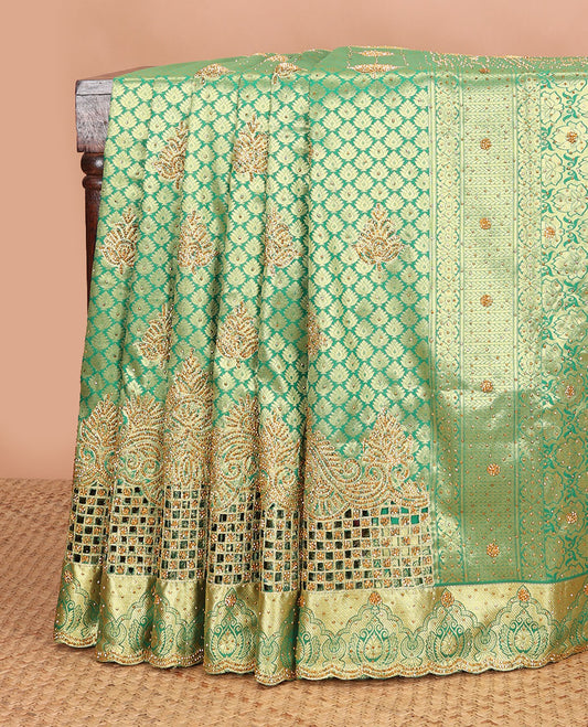 Green jacquard stone embroidered silk saree, stone embroidered scallop zari design cut work border & zari woven & stone embroidered pallu