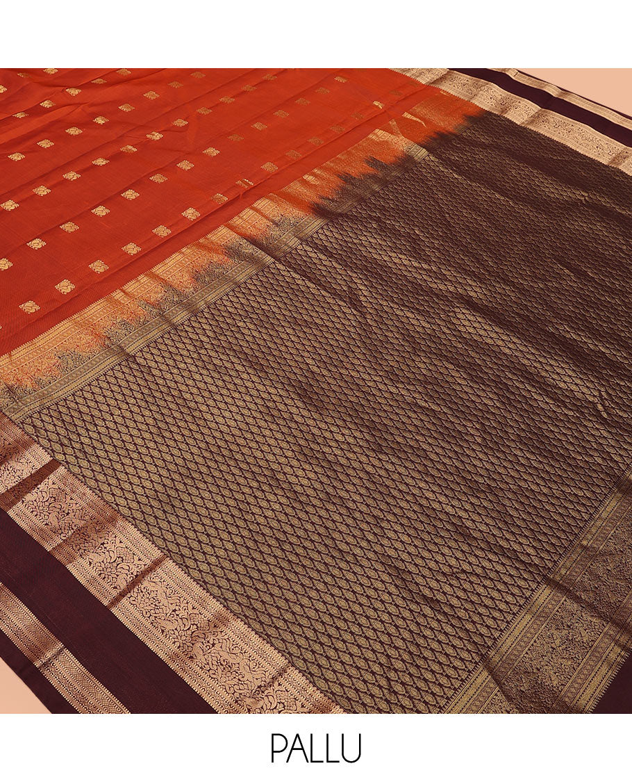 Rust Orange Vasundhara Lite-Silk Mix Saree Showcasing Mayil Buttas, Complemented with a Contrast Rettai Pettu Border Featuring Muthu, Diamond, and Mayil Designs, Adorned with Jaal Pallu, and a Contrast Blouse