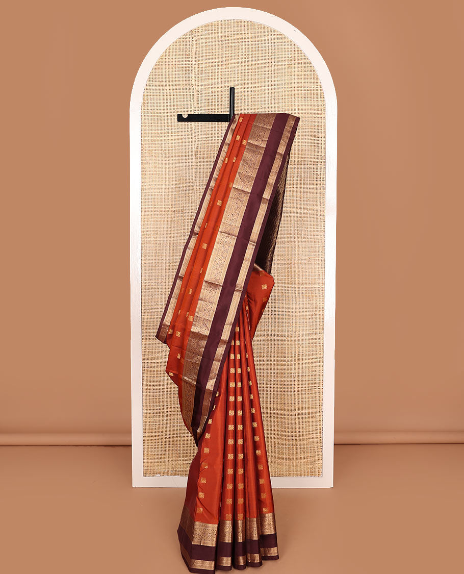 Rust Orange Vasundhara Lite-Silk Mix Saree Showcasing Mayil Buttas, Complemented with a Contrast Rettai Pettu Border Featuring Muthu, Diamond, and Mayil Designs, Adorned with Jaal Pallu, and a Contrast Blouse