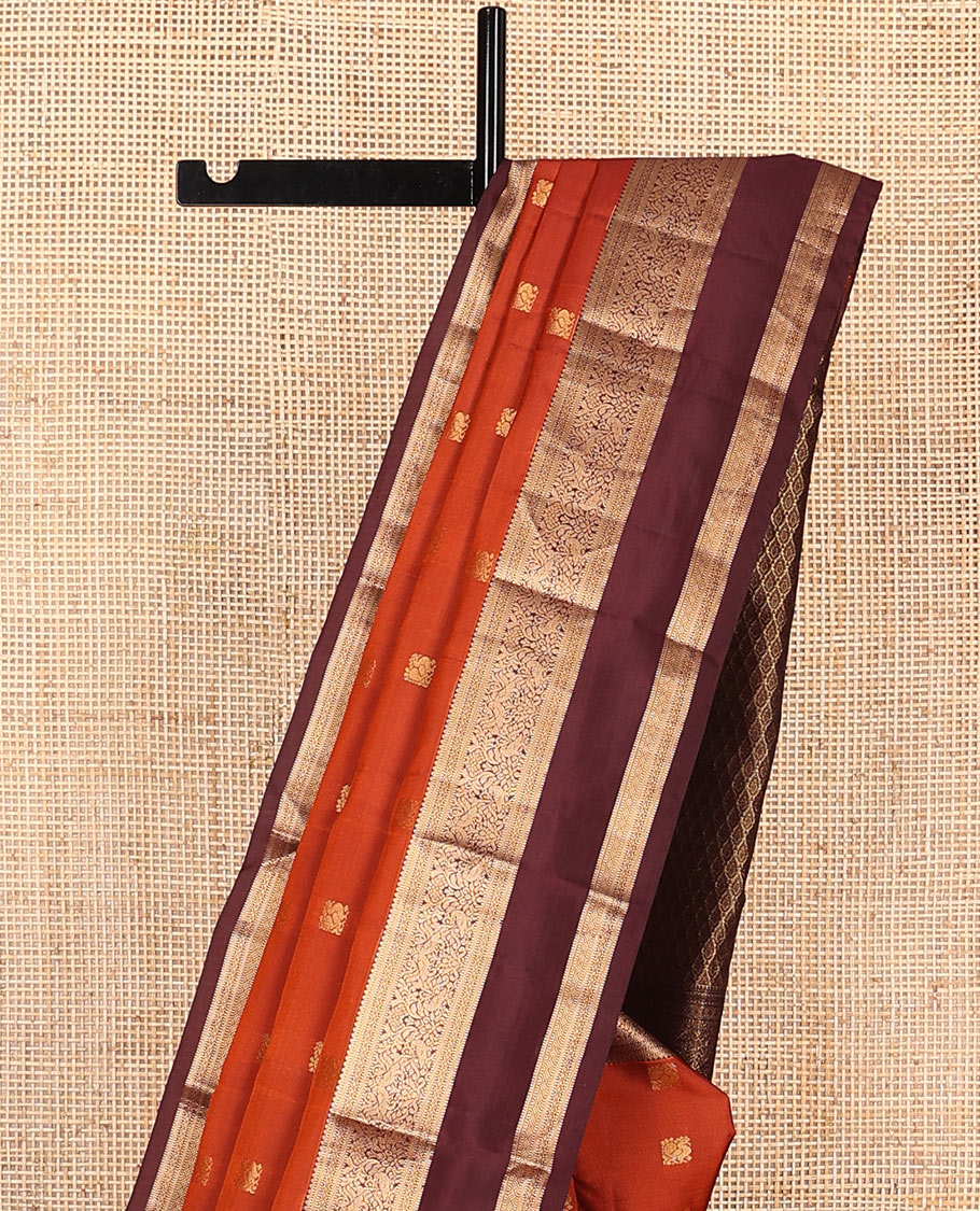 Rust Orange Vasundhara Lite-Silk Mix Saree Showcasing Mayil Buttas, Complemented with a Contrast Rettai Pettu Border Featuring Muthu, Diamond, and Mayil Designs, Adorned with Jaal Pallu, and a Contrast Blouse