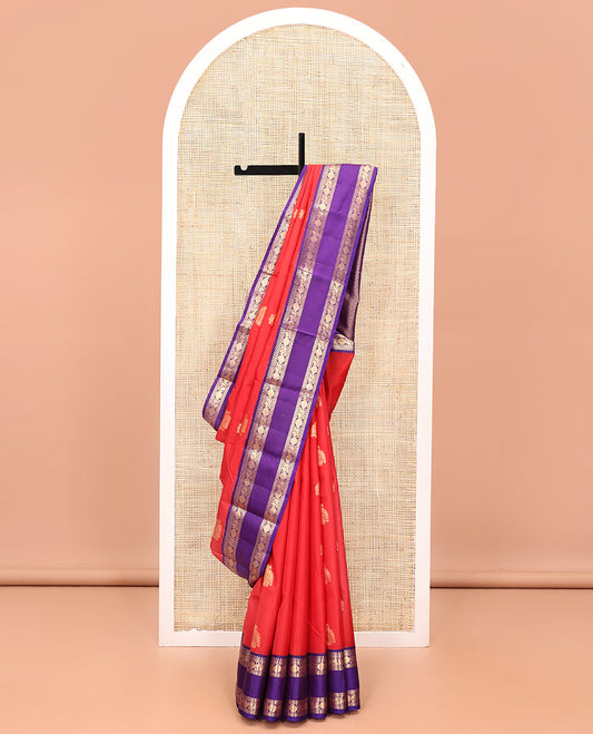 Red Vasundhara Lite Silk Mix Saree, Steeped in Richness of Zari Buttas All Over Its Body, Complemented by a Contrast Rettai Pettu Border of Salngai, Neli, Poun, and Mayil Designs, Grand Pallu, and Paired with a Contrast Blouse