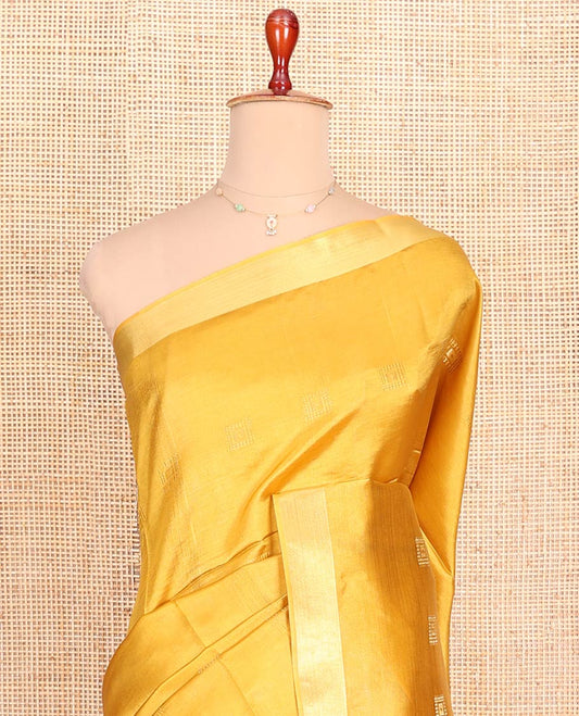 Yellow Banana Pith Saree Sparsely Sparkled with Square Zari Buttas All Over Its Body, Bavanji Border, Gleaming Zari Striped Pallu, and Paired with a Matching Plain Blouse
