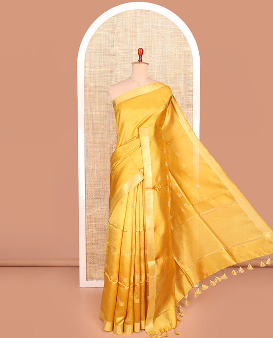 Yellow Banana Pith Saree Sparsely Sparkled with Square Zari Buttas All Over Its Body, Bavanji Border, Gleaming Zari Striped Pallu, and Paired with a Matching Plain Blouse