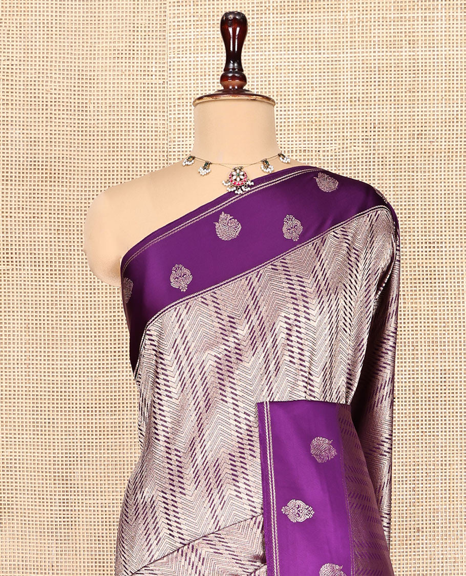 Purple Russian Dola Silk Saree, Meticulously Crafted with Zari Zig-Zag Jacquard on Its Body, Highlighted by Zari Buttas Woven Satin Border, Intricately Designed Pallu, and Paired with a Matching Blouse