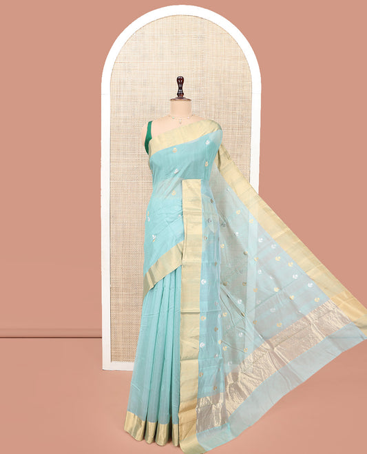 Blue Chanderi Cotton Saree, Gleamed Up with Floral Buttas All Over Its Body, Highlighted by a Bavanji Border, Pallu Steeped with Zari Stripes, and Paired with a Matching Blouse