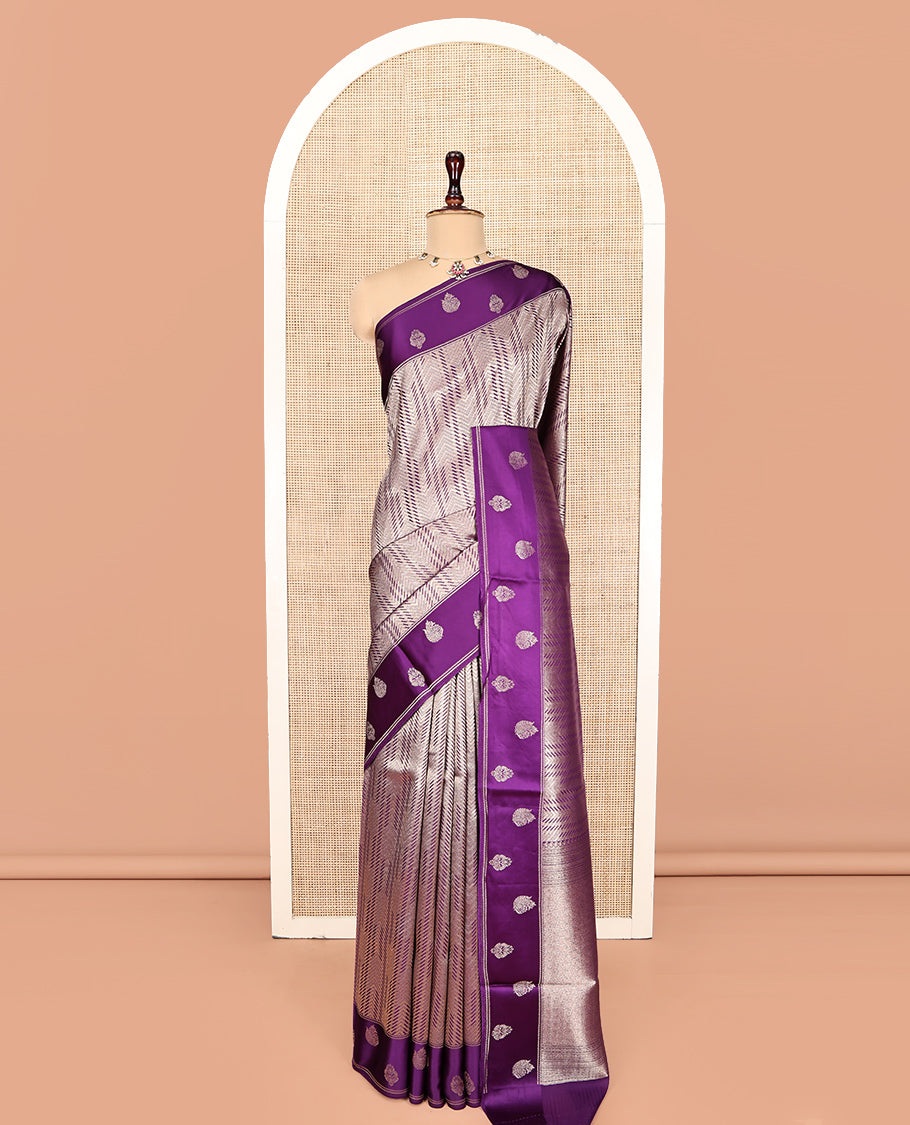 Purple Russian Dola Silk Saree, Meticulously Crafted with Zari Zig-Zag Jacquard on Its Body, Highlighted by Zari Buttas Woven Satin Border, Intricately Designed Pallu, and Paired with a Matching Blouse