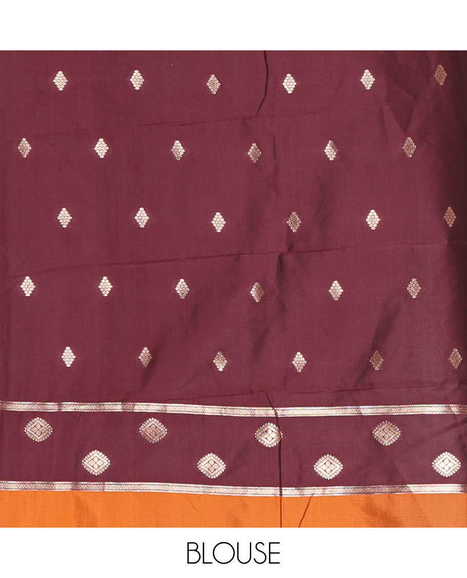 Rust Orange Soft Silk Saree Gracefully Embellished with Zari Buttas Woven All Over Its Body, Highlighted with a Contrast Traditional Zari Border Featuring Floral Creeper Design, Zari-Rich Jaal Pallu, and Paired with a Contrast Zari Design Blouse
