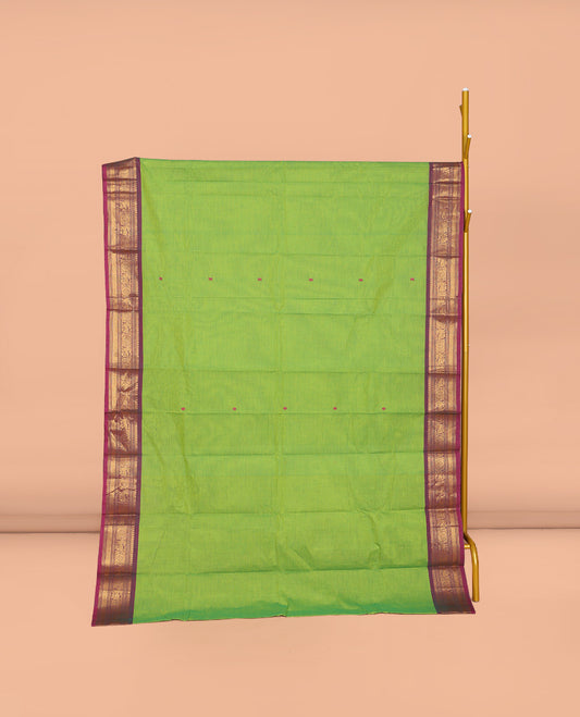 Parrot Green Chettinad Cotton Saree, Finely Crafted with Thread Buttas All Over Its Body, Complemented by a Contrast Traditional Zari Design Woven Border, Pallu of Stripes and Buttas, and Paired with a Matching Blouse