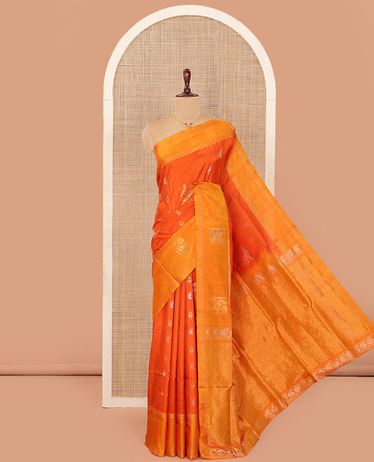 Orange Uppada Silk Saree Decked Up with Paisley and Peacock Buttas All Over Its Body, Complemented by Contrast Border of Peacock Designs, Sparsely Sparkled Pallu of Jaal Designs, and Paired with a Contrast Blouse