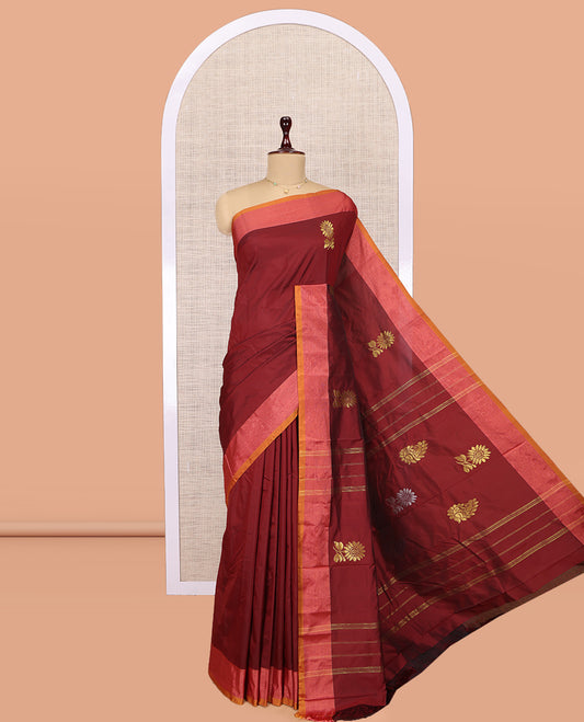 Maroon Arani Saree, Adorned with Floral Zari Buttas, a Contrast Border, Contrast Floral Buttas Pallu, and a Matching Blouse