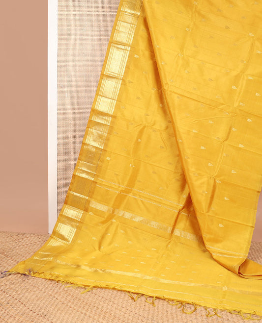 Mustard buttas kancheepuram silk saree with contrast border of thilakam mokku, banaras, muthu,checked design & zari design pallu