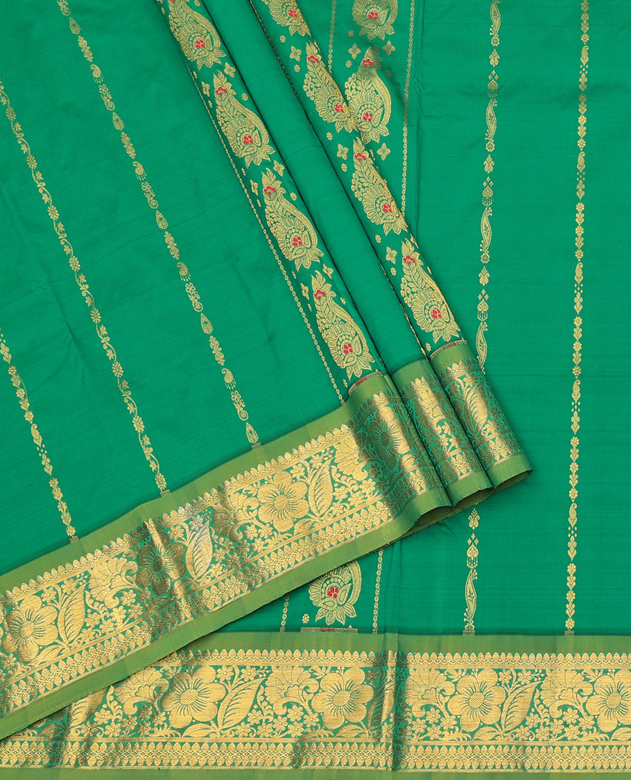 Green Art Silk Pavadai Material Set, Decked Up with Zari Designs on Its Skirt, Complemented by a Contrast Paisley-Floral Zari Border, and a Matching Blouse