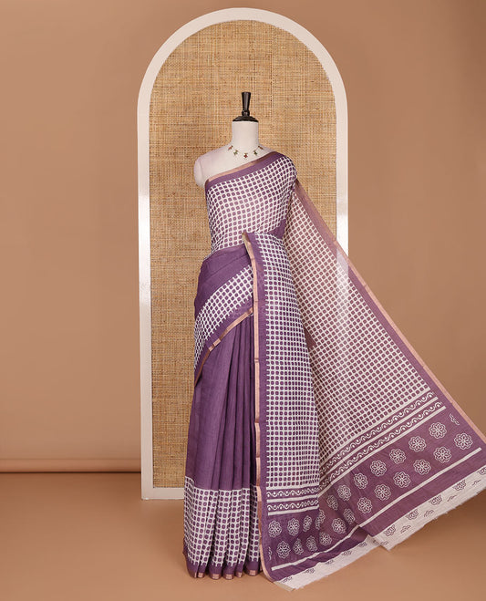 Lavender plain and polka dots printed linen cotton saree with piping zari border, floral-geometric print pallu, and contrast flower buttas printed  blouse