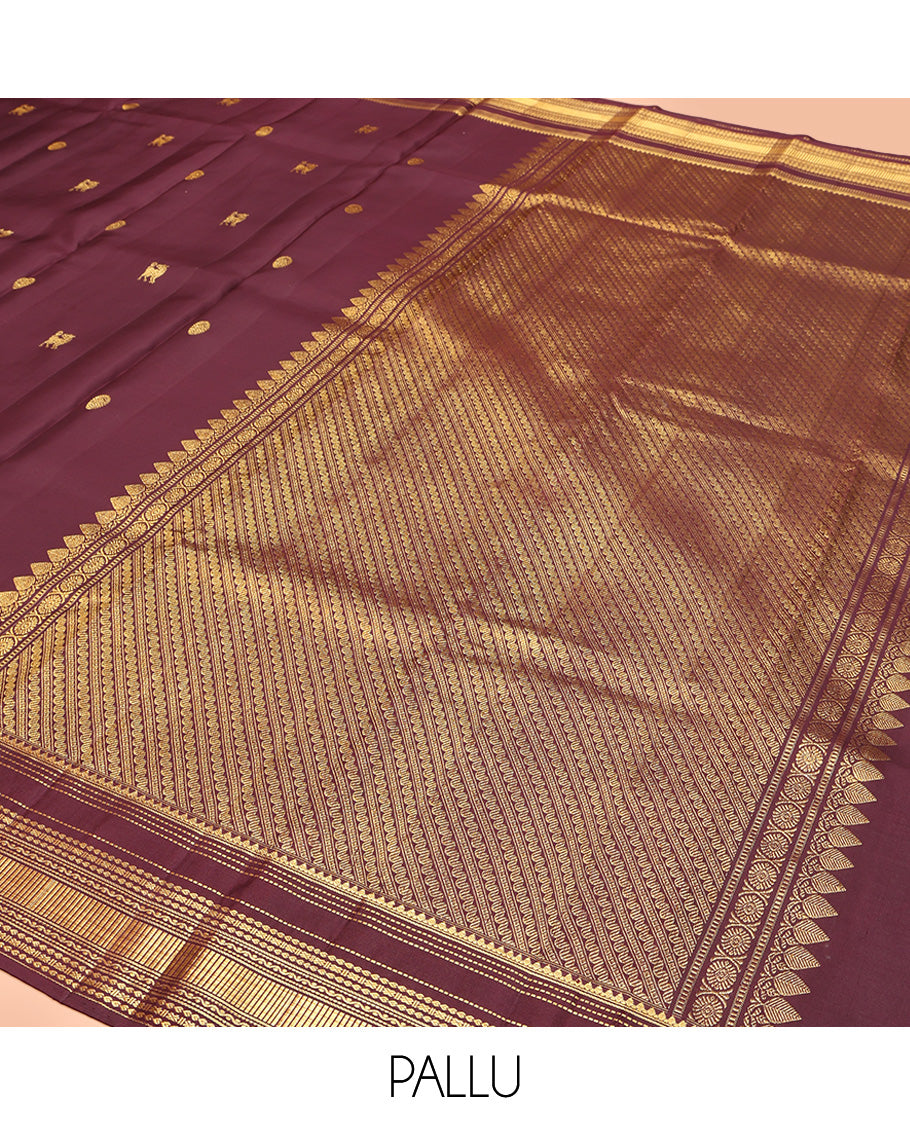 Brown Kanchipuram Silk Saree, Subtly Enriched with Yaali Buttas All Over Its Body, Highlighted by Zari Border of Thilakam, Muthu, Cross Kamalam, and Neli Designs, Grand Pallu, and Paired with a Matching Blouse