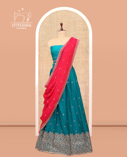 Blue Banarasi Half-Saree, Opulently Embellished with Buttas Embroidered Skirt, Floral Embroidered Border, Matching Blouse, and Contrast Embroidered Scallop Dupatta