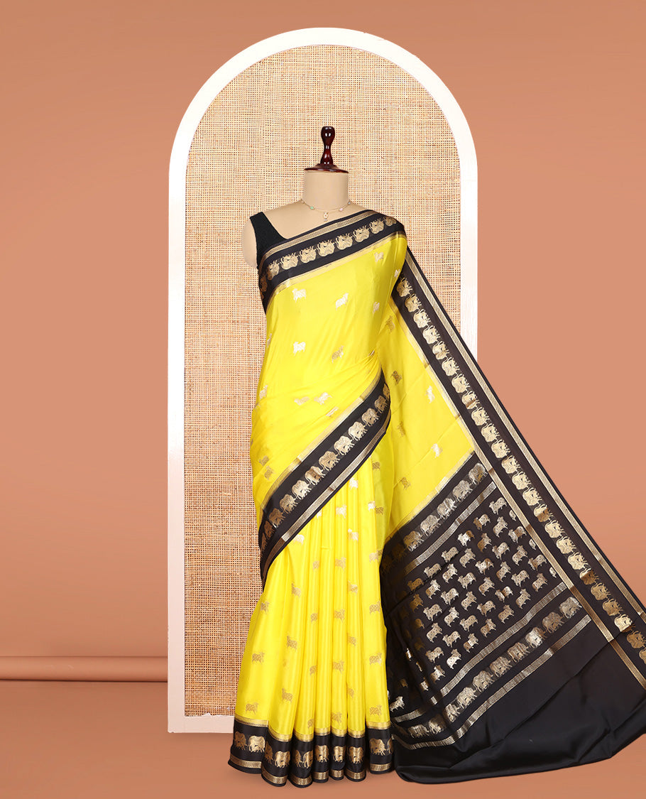Yellow Mysore Silk Saree, Artfully Detailed with Pichwai Cow Buttas, Complemented by a Contrast Pichwai Cow Zari Border, Pallu Steeped with Pichwai Cows, and a Contrast Blouse