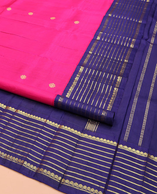 Pink Kanchipuram Silk Saree, Decked Up with Zari Buttas on Its Body, Complemented by a Contrast One-Sided Korvai Border of Thilakam Mokku, and Banaras Designs, Pallu Steeped with Kamalam Zari Designs, and Comes Without a Blouse