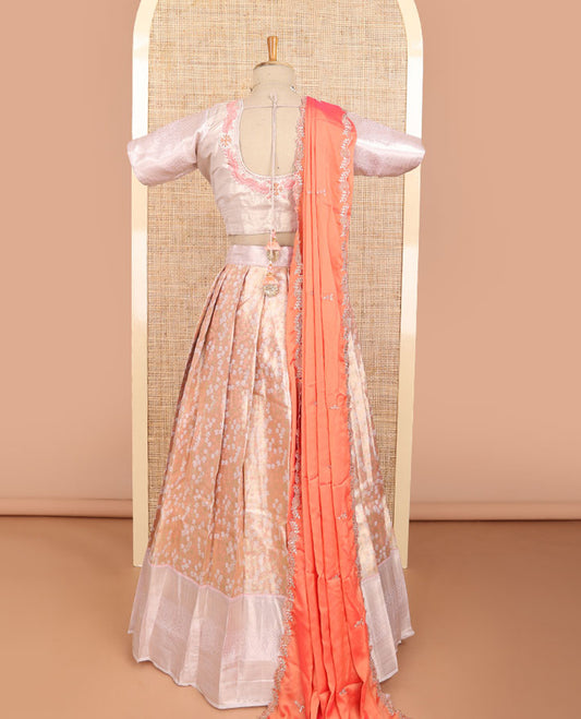 Light orange floral jacquard half saree with contrast zari design border, floral embroidered blouse & floral embroidery dhavani