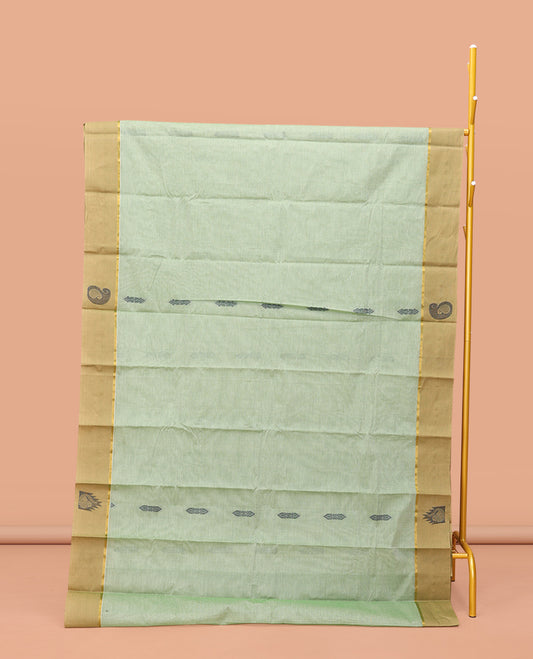 Green Kanchi Cotton Saree Features Buttas on Its Body, Contrast Temple and Paisley Border, Intricately Designed Pallu, and a Matching Blouse