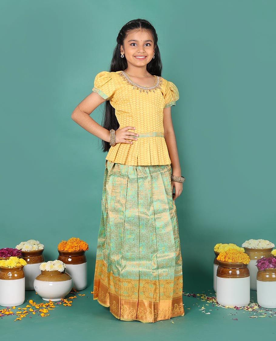 Green art silk readymade pavadai set, jacquard with contrast traditional zari border skirt, and contrast round neck embroidered puff-sleeve blouse