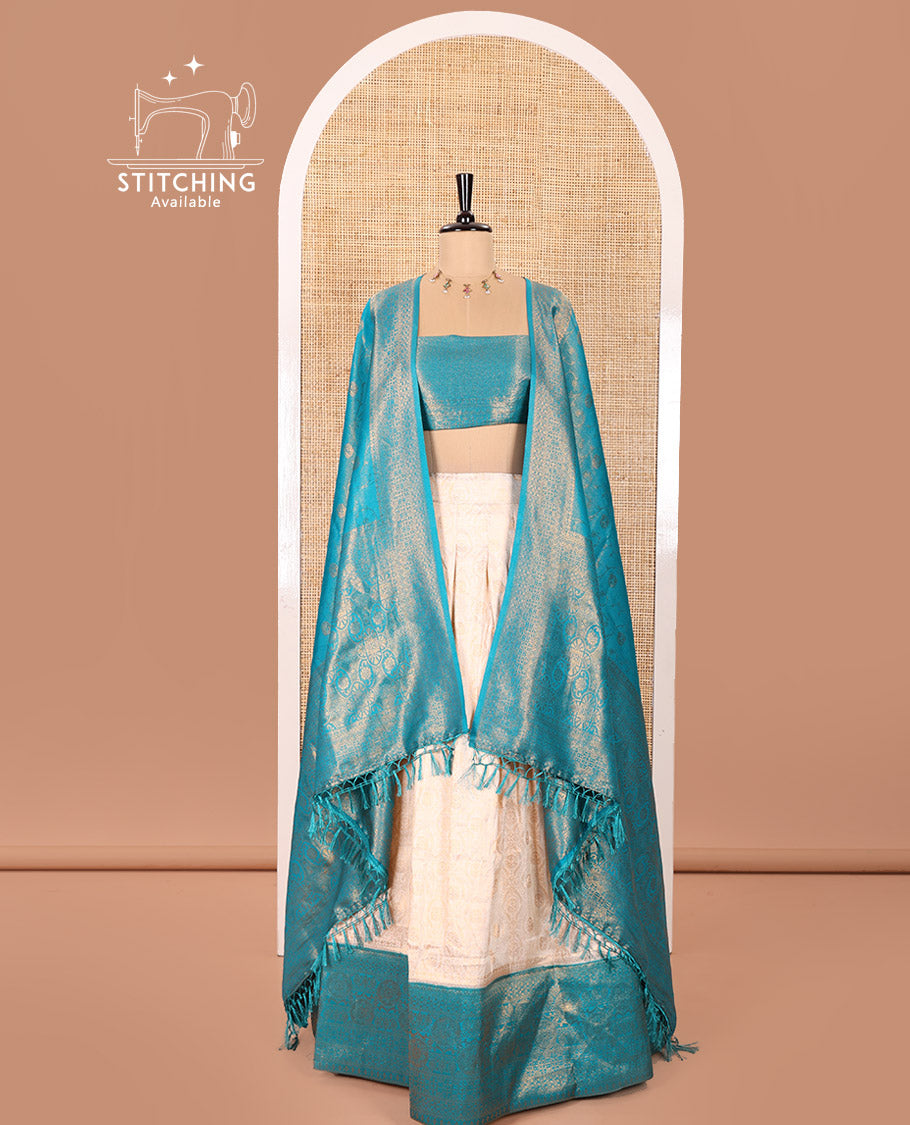 Cream and Blue Banaras Softy Half-Saree Featuring Jacquard Design All Over the Skirt, Decorated with a Contrast Geometric Zari Design Border, Paired with a Jacquard Blouse, and a Banaras Softy Dhavani with Floral Jaal Jacquard Design