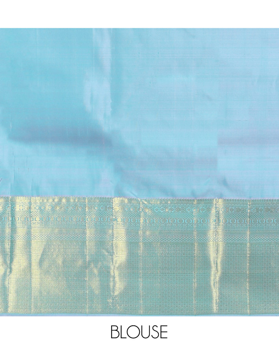 Blue Kanchipuram Silk Saree, Sparsely Woven with Zari Buttas, Highlighted by Zari Border of Manga, Neli, Mayil Kann, Kamalam, Poun, and Jaal Design, Zari Design Pallu, and a Matching Blouse