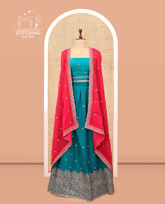 Blue Banarasi Half-Saree, Opulently Embellished with Buttas Embroidered Skirt, Floral Embroidered Border, Matching Blouse, and Contrast Embroidered Scallop Dupatta