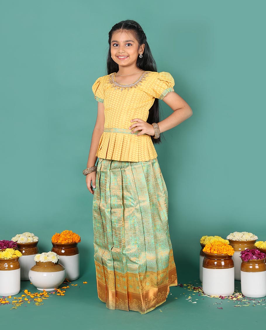 Green art silk readymade pavadai set, jacquard with contrast traditional zari border skirt, and contrast round neck embroidered puff-sleeve blouse