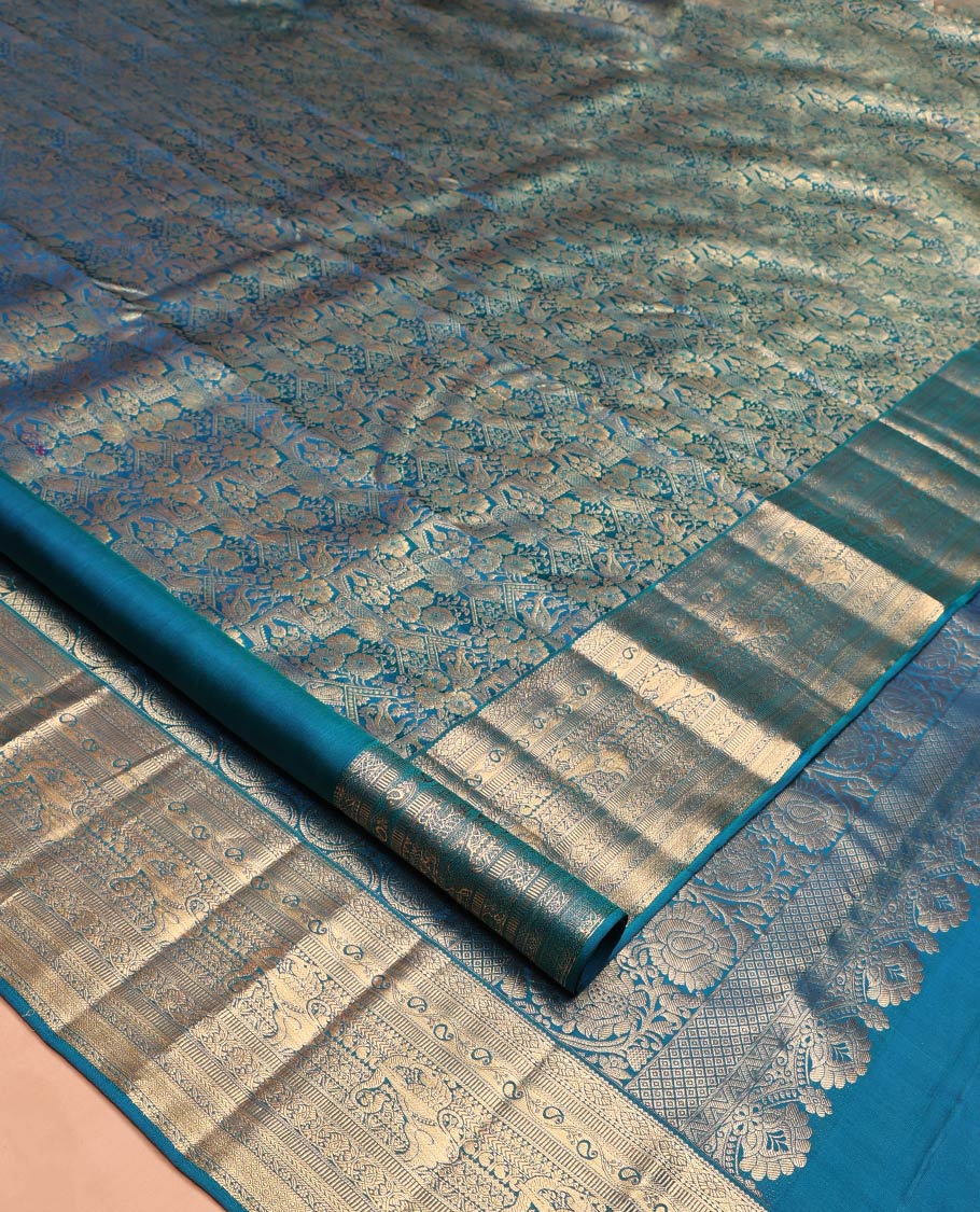 Blue Kanchipuram Wedding Silk Saree, Meticulously Crafted with Jacquard Design on Its Body, Highlighted by Zari Border of Cross Kamalam, Kodi Manga, Muthu, Kathir, Mayil Kann, and Yaali Designs, Chakram Design Pallu, and Paired with a Matching Blouse