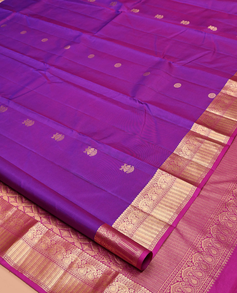Purple Kanchipuram Silk Saree, Detailed with Chakram and Iruthalai Pakshi Buttas All Over Its Body, Complemented by a Contrast Border of Salngai, Muthu, Neli, Manga, and Kathir Designs, Intricately Designed Pallu, and Paired with a Contrast Blouse