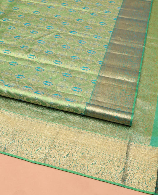 Green Kanchipuram Wedding Silk Saree, Elegantly Highlighted with Meenakari Jacquard on Its Body, Highlighted by a Zari Border of Jaal, and Arumbu Manga Designs, Grand Jaal Pallu, and Paired with a Matching Blouse