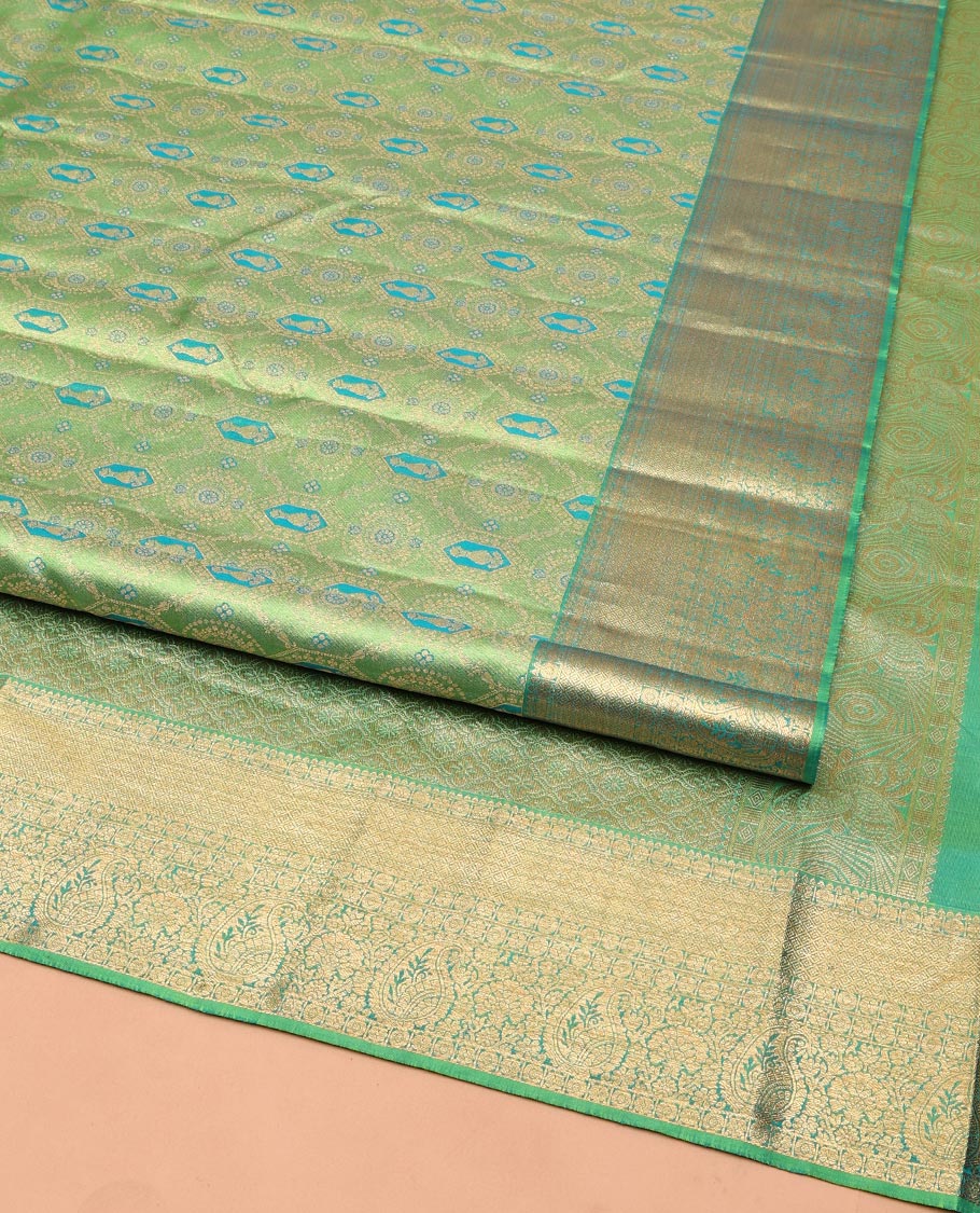 Green Kanchipuram Wedding Silk Saree, Elegantly Highlighted with Meenakari Jacquard on Its Body, Highlighted by a Zari Border of Jaal, and Arumbu Manga Designs, Grand Jaal Pallu, and Paired with a Matching Blouse
