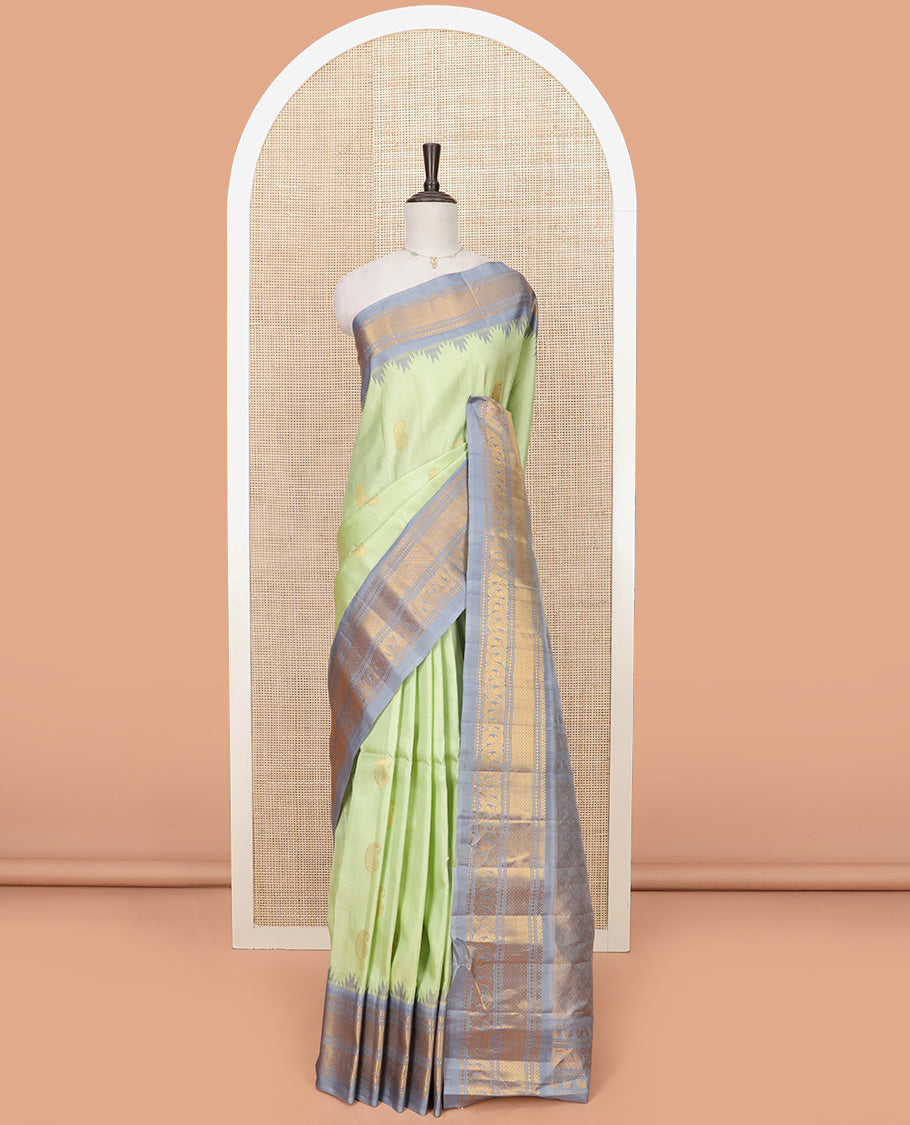 Pista Green Gadwal Saree Woven with Zari Paisley Buttas, a Contrast Temple Traditional Zari Design Border, Pallu of Jaal Design, and a Contrast Blouse with Zari Designs