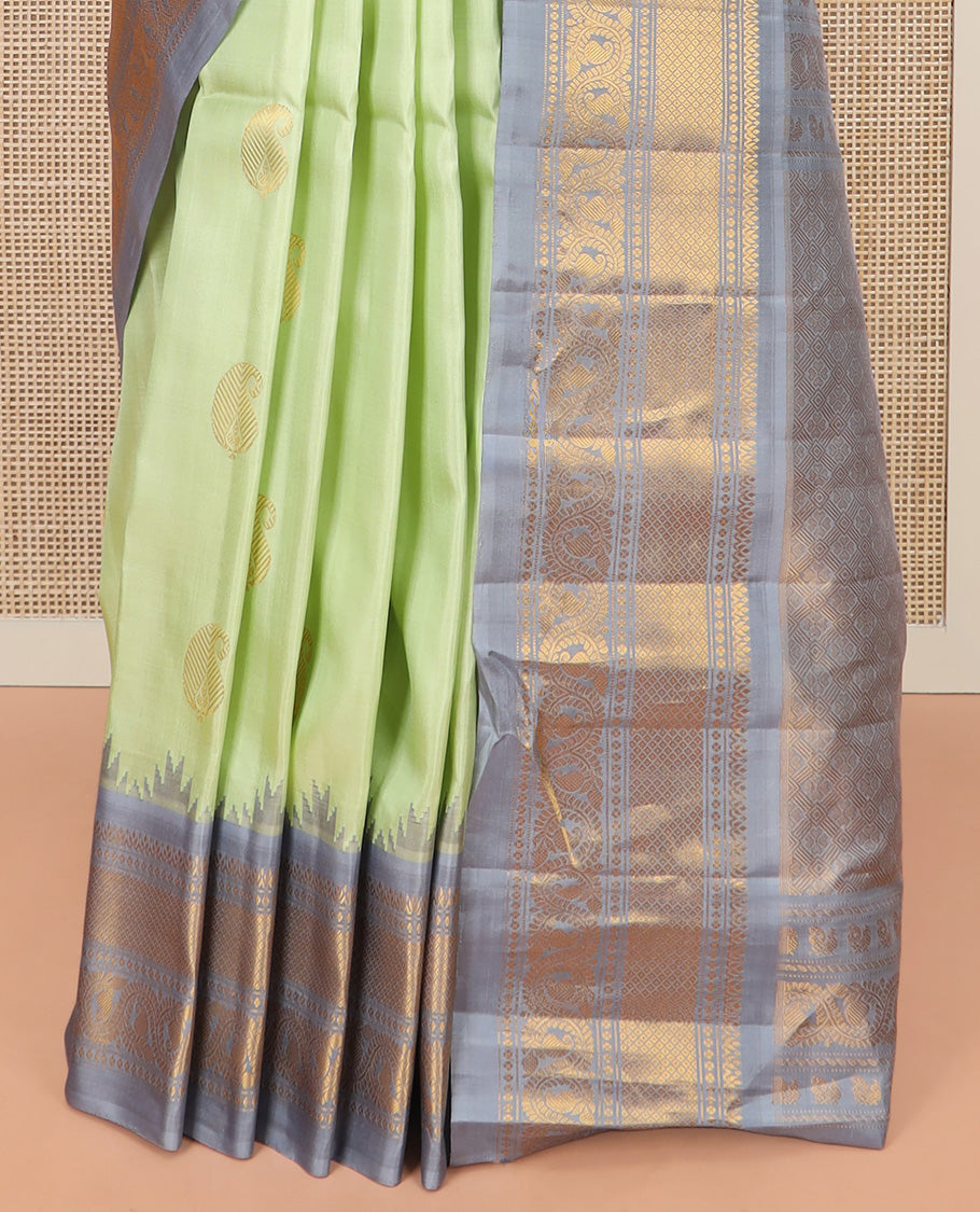 Pista Green Gadwal Saree Woven with Zari Paisley Buttas, a Contrast Temple Traditional Zari Design Border, Pallu of Jaal Design, and a Contrast Blouse with Zari Designs